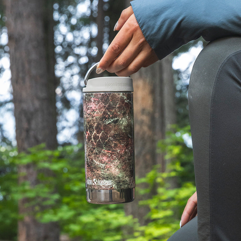 12oz-tkwide-with-cafe-cap-mossy-oak-u8 12oz_tumbler_mossyoak_rainbowtrout_hand_closeup_square.jpg