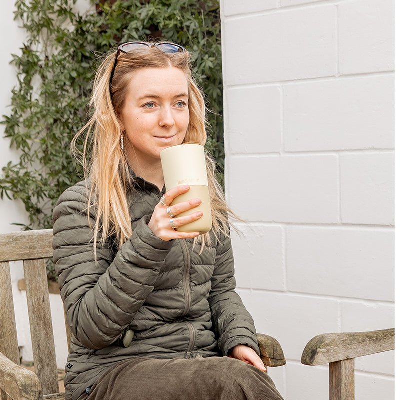 16oz-rise-tumbler-f4 16oz_rise_tumbler_wax_yellow_woman_seat_outside_square.jpg
