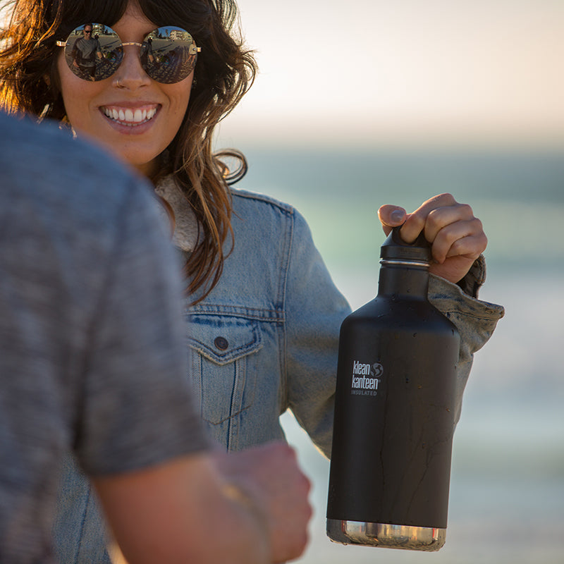 64oz-classic-with-loop-cap-p1 64oz_insulated_classic_black_beach_girl_hand_square.jpg