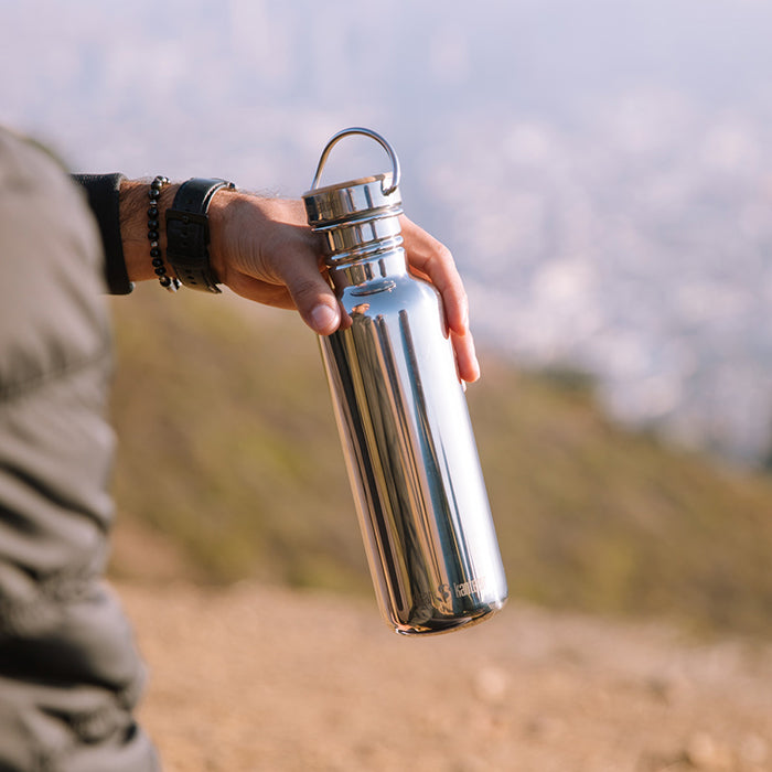 27oz-reflect-with-bamboo-cap-u9 K27SSLRF-MS-BAMBOO_reflect_bottle_hand_lifestyle.jpg